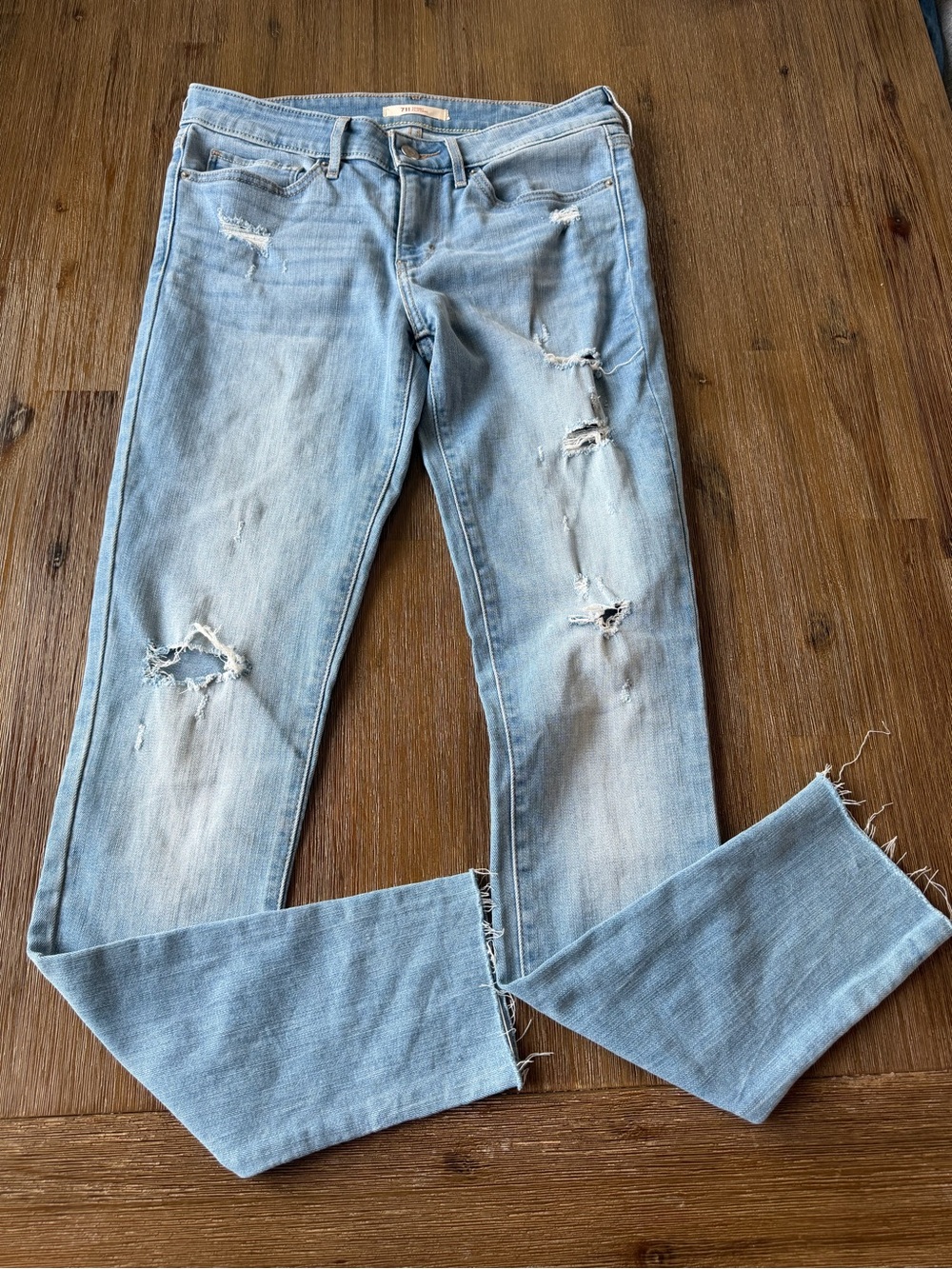Levi's 711 Blue Distressed Skinny Jeans with Raw Hem size 27 women’s